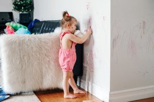 Child drawing on walls